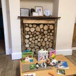 play area in day care, books and toys on table